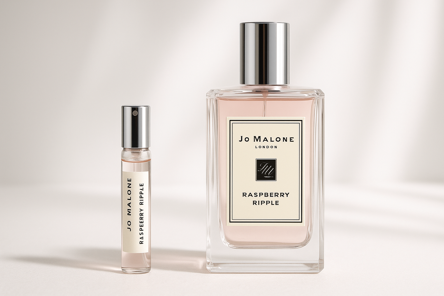Jo Malone Raspberry Ripple 2ml perfume sample standing next to 100ml Jo Malone Raspberry Ripple perfume bottle