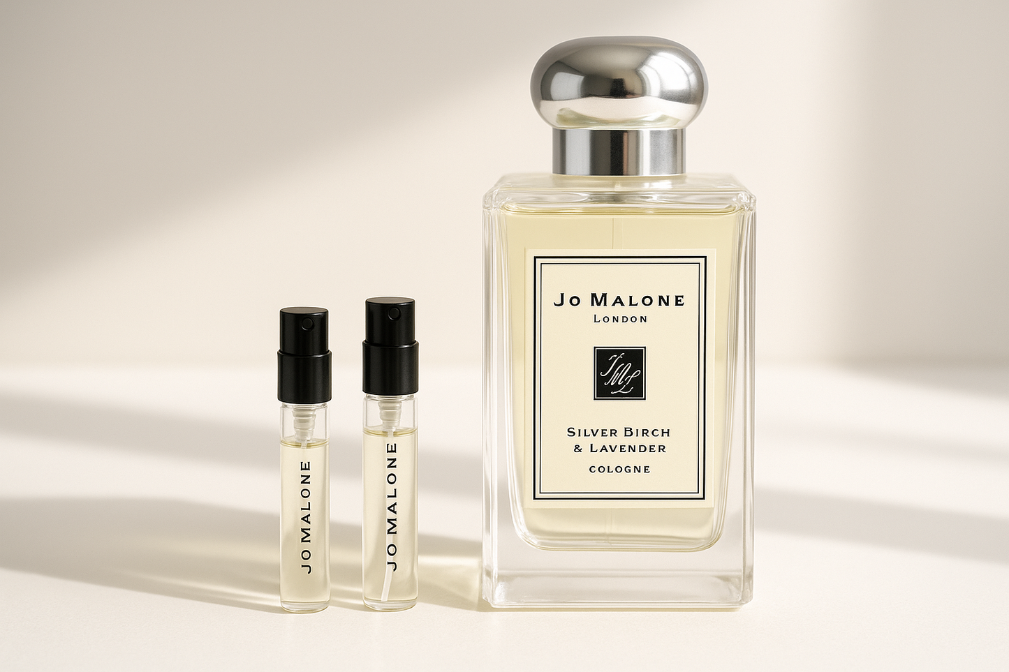 Jo Malone Silver Birch & Lavender Cologne perfume samples 1ml standing next to Jo Malone Silver Birch 100ml fragrance